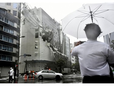 Scaffolding of a building being demolished, collapse, following a powerful typhoon in Osaka, western Japan, Tuesday, Sept. 4, 2018.