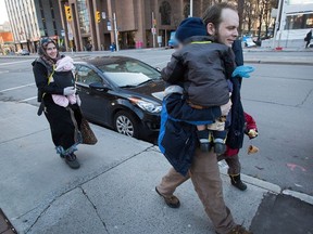 Joshua Boyle, his wife, Caitlan Boyle and their three children are seen walking up Elgin St. in a file photo.