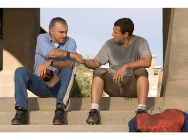 Burt Reynolds (L) with Adam Sandler in the 2005 remake of "The Longest Yard" 2005 re-make LY-00795R                                 Former pro quarterback Ð and now inmate -- Paul Crewe (Adam Sandler, right), forced to field a football team of inmates to take on the guards, gets some help from coach Nate Scarborough (Burt Reynolds, left) in the comedy  "The Longest Yard" Paramount Pictures and Columbia Pictures present a Happy Madison/MTV Films Production in association with Callahan Filmworks,  "The Longest Yard" , a Peter Segal film starring Adam Sandler, Chris Rock and Burt Reynolds. Directed by Peter Segal ( "50 First Dates,"   "Anger Management," ) from a screenplay by Sheldon Turner based on the screenplay by Tracy Keenan Wynn from a story by Albert S. Ruddy.  Jack Giarraputo is the producer.  The executive producers are Van Toffler, David Gale, Barry Bernardi, Allen Covert, Tim Herlihy, Michael Ewing, and Albert S. Ruddy.  The film also stars James Cromwell, Nelly, and William Fichtner. The film is distributed in the United States by Paramount Pictures.