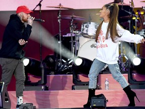 In this handout provided by 'One Love Manchester' benefit concert (L) Mac Miller and Ariana Grande perform on stage on June 4, 2017, in Manchester, England.