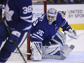 Maple Leafs Curtis McElhinney keeps and eye on the action during Friday's pre-season game against the Buffalo Sabres.