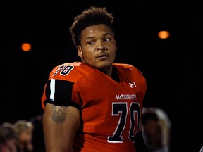 In this Sept. 16, 2016, file photo, McDonogh high school football lineman Jordan McNair watches from the sideline during a game in McDonogh, Md.
