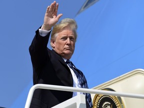 U.S. President Donald Trump walks up the steps of Air Force One at Andrews Air Force Base, Md., Thursday, Sept. 6, 2018. Trump is heading to Montana for a rally.