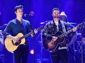 Justin Timberlake (R) and Shawn Mendes (L) perform on stage during the iHeartRadio Music Festival at the T-Mobile arena in Las Vegas on Sept. 22, 2018.