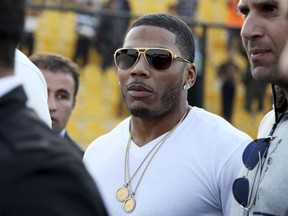 In this March 13, 2015 file photo, rapper Nelly approaches the stage for a concert in Irbil, northern Iraq.