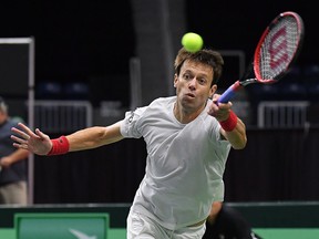Daniel Nestor, of Canada, returns a shot from from the team of Matwe Middelkoop and Jean-Julien Rojer, of the Netherlands, in Davis Cup tennis action in Toronto on Saturday, Sept. 15, 2018.