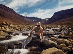 Ken Butler poses at Gros Morne's iconic tablelands in an undated handout from the 2019 merb'ys calendar. The popular charity initiative is donating this year's proceeds to a Newfoundland and Labrador coalition that's working to engage men in violence prevention.