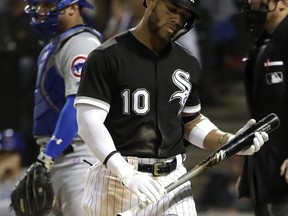 FILE - In this Saturday, Sept. 22, 2018 file photo, Chicago White Sox's Yoan Moncada reacts after being called out on strikes during the fourth inning of a baseball game against the Chicago Cubs in Chicago. The most-heard sound at major league ballparks this year was "Strike three!" Strikeouts will exceed hits over a full season for the first time in major league history.