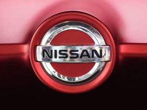 This June 14, 2018, file photo, shows a Nissan logo on a car on display at the automaker's showroom in Tokyo.
