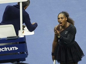 FILE - In this Saturday, Sept. 8, 2018, file photo, Serena Williams argues with the chair umpire during a match against Naomi Osaka, of Japan, during the women's finals of the U.S. Open tennis tournament at the USTA Billie Jean King National Tennis Center,  in New York. Some black women say Serena Williams' experience at the U.S. Open final resonates with them. They say they are often forced to watch their tone and words in the workplace in ways that men and other women are not. Otherwise, they say, they risk being branded an "Angry Black Woman."