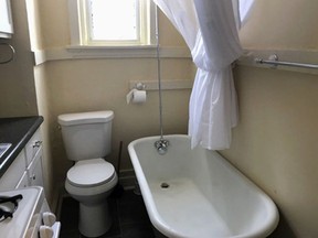 This photo from a rental ad provided by S.F. Shannon Real Estate Management LLC shows a toilet and bathtub in the kitchen of a 200-square-foot apartment in St. Louis. The toilet, bathtub, oven and sink all share a room. A St. Louis man is the new tenant of the tiny apartment.