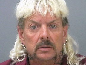 This photo provided by the Santa Rose County Jail in Milton, Fla., shows Joseph Maldonado-Passage, an Oklahoma zookeeper, who was indicted on federal murder-for-hire charges. Carole Baskin, the operator of a Florida-based animal sanctuary, says she was the target of Maldonado-Passage, who goes by the nickname "Joe Exotic." Maldonado-Passage, who remains jailed in Florida, also ran unsuccessfully for Oklahoma governor as a Libertarian this year.
