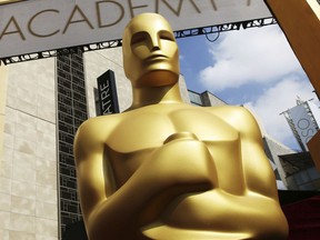 In this Feb. 21, 2015 file photo, an Oscar statue appears outside the Dolby Theatre for the 87th Academy Awards in Los Angeles.