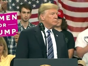 President Donald Trump speaks at a Montana campaign rally. Plaid Shirt Guy is just over his right shoulder. (YouTube screen grab)