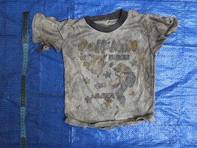 In this undated photo provided by the Veracruz State Prosecutor's Office shows clothing items found at the site of a clandestine burial pit in the Gulf coast state of Veracruz, Mexico.