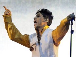 Prince performs on stage at the Stade de France in Saint-Denis, outside Paris, on June 30, 2011. Thousands of fans want a grand jury investigation into the musician's 2016 death.