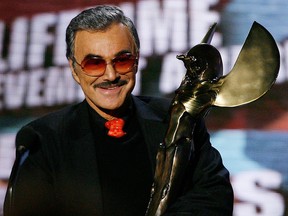 In this May 20, 2007, file photo, Burt Reynolds accepts the award for "Taurus Lifetime Achievement for an Action Movie Star" onstage during the Seventh Annual Taurus World Stunt Awards at Paramount Pictures  in Los Angeles.