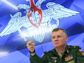 Defense Ministry spokesman Maj. Gen. Igor Konashenkov speaks to the media during a press conference, in Moscow, Russia, Monday, Sept. 17, 2018. The Russian military said on Monday that the missile that shot down Malaysia Airlines Flight 17, killing all 298 people on board, came from the arsenals of the Ukrainian army, not from Russia. (Kirill Zykov/Moscow News Agency via AP) ORG XMIT: XAZ115