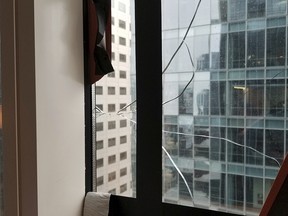 This recent but undated photo provided by the San Francisco Department of Building Inspection shows a window that has cracked in the Millennium Tower Building in San Francisco. (Department of Building Inspection via AP)