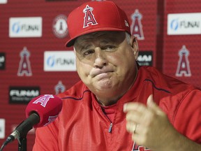 Mike Scioscia announces that he will not return as Angels manager after 19 seasons, ending the longest current tenure in Major League Baseball, following his last game, a 5-4 win over the Oakland Athletics in Anaheim, Calif., Sunday, Sept. 30, 2018. (AP Photo/Reed Saxon)
