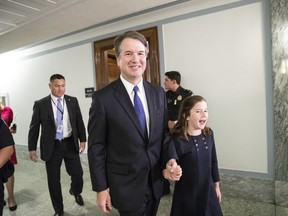 U.S. President Donald Trump's Supreme Court nominee, Brett Kavanaugh, with daughter Liza, departs his Senate Judiciary Committee confirmation hearing on Capitol Hill in Washington, Tuesday, Sept. 4, 2018.