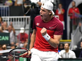 Denis Shapovalov, of Canada, pumps his fist after winning a point against Robin Haase, of the Netherlands, in Davis Cup action in Toronto on Friday, September 14, 2018. (THE CANADIAN PRESS/Jon Blacker)