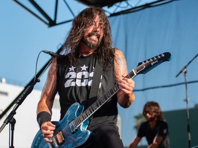 Dave Grohl of The Foo Fighters performs with Queen drummer Roger Taylor as Chevy Metal and the Holy Shits at the 2018 Cal Jam Festival.