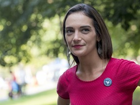 FILE - In this Wednesday, Aug. 15, 2018 file photo, Democratic New York state Senate candidate Julia Salazar smiles as she speaks to a supporter before a rally in McCarren Park in the Brooklyn borough of New York. Salazer said Tuesday, Sept. 11. 2018 that she was sexually assaulted five years ago by David Keyes , a spokesman for Israeli Prime Minister Benjamin Netanyahu, an accusation the man denies.