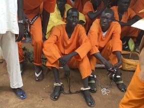 This undated photo shows prisoners sitting together at the central prison in the capital Juba, South Sudan.