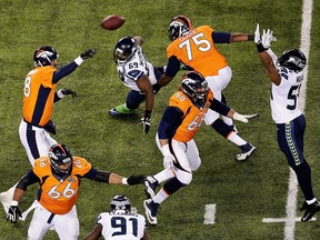 Quarterback Peyton Manning of the Denver Broncos throws an interception during the first quarter of Super Bowl XLVIII at MetLife Stadium against the Seattle Seahawks on Feb. 2, 2014 in East Rutherford, N.J.
