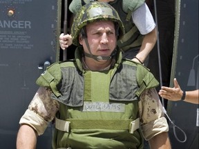 Former Maple Leafs enforcer Dave (Tiger) Williams arrives with other ex-NHLers to visit the troops at the base in Kandahar, Afghanistan, May 2, 2007.