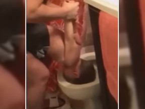 Police are investigating after a viral video shows a mom dipping her son's head into a toilet. (YouTube)