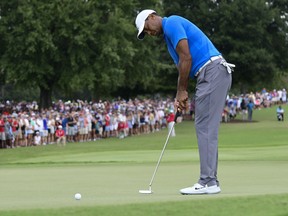 Tiger Woods putts for birdie on the third hole during the third round of the Tour Championship golf tournament Saturday, Sept. 22, 2018, in Atlanta.
