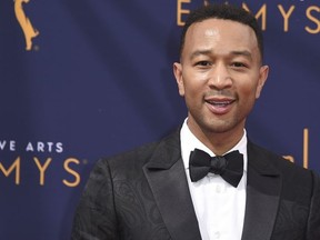 In this Sept. 9, 2018 file photo, John Legend arrives at the Creative Arts Emmy Awards in Los Angeles. Legend will become a coach on NBC's "The Voice."