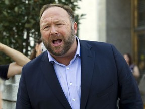 Conspiracy theorist Alex Jones speaks outside of the Dirksen building of Capitol Hill after listening to Facebook COO Sheryl Sandberg and Twitter CEO Jack Dorsey testify before the Senate Intelligence Committee on 'Foreign Influence Operations and Their Use of Social Media Platforms' on Capitol Hill in Washington on Wednesday, Sept. 5, 2018.