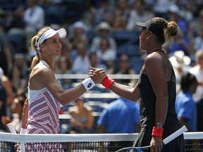 Naomi Osaka, right, of Japan, shakes hands with Lesia Tsurenko, of Ukraine, after Osaka defeated Tsurenko during the quarterfinals of the U.S. Open tennis tournament, Wednesday, Sept. 5, 2018, in New York.