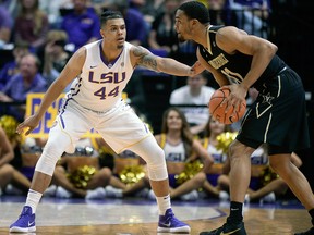 In this Feb. 20, 2018, file photo, LSU forward Wayde Sims defends against Vanderbilt forward Jeff Roberson during an NCAA college basketball game, in Baton Rouge, La.