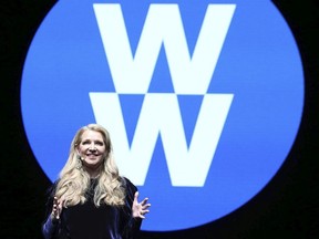 FILE- In this Feb. 7, 2018, file image distributed for Weight Watchers, Weight Watchers President and Chief Executive Officer Mindy Grossman speaks at a global employee event in New York. Weight Watchers is trimming its name to just two letters: WW. The company says it is renaming itself to focus more on overall wellness and not just dieting. (Amy Sussman/AP Images for Weight Watchers, File) ORG XMIT: NYBZ166