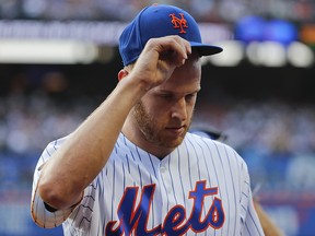 In this July 14, 2018, file photo, New York Mets starting pitcher Zack Wheeler tips his hat to the crowd as he leaves in the eighth inning against the Washington Nationals in New York. (AP Photo/Julie Jacobson, File)