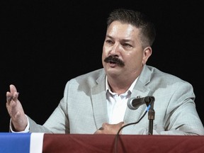 In this July 8, 2018, file photo, Randy Bryce, a Wisconsin Democratic candidate for the U.S. House, answers a question during a debate in Lake Geneva, Wis.