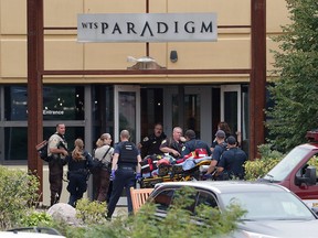 Emergency personnel arrive on the scene of a shooting at a software company in Middleton, Wis., Wednesday, Sept. 19, 2018.