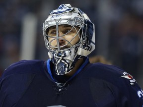 Winnipeg Jets goaltender Ondrej Pavelec takes a breather during NHL action against the San Jose Sharks in Winnipeg on Tues., Jan. 24, 2017. Kevin King/Winnipeg Sun/Postmedia Network ORG XMIT: POS1701242205542409