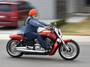 Bhupinder Singh rides a motorcycle without a helmet in Edmonton on May 9, 2018. Ed Kaiser/Postmedia