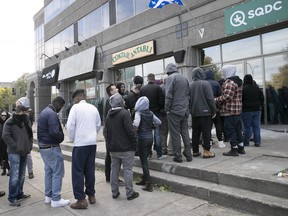 Customers wait in line at the l'Acadie Blvd. SQDC outlet in Montreal on the first day of legal recreational cannabis in Canada on Wednesday, Oct. 17, 2018.