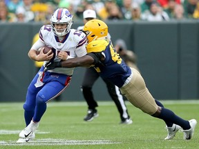 Josh Allen of the Buffalo Bills is tackled by Oren Burks of the Green Bay Packers during the third quarter of a game at Lambeau Field on Sept. 30, 2018 in Green Bay, Wisconsin. (Dylan Buell/Getty Images)