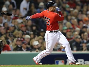 Steve Pearce of the Boston Red Sox hits an RBI single in the third inning against the New York Yankees during Game One of the American League Division Series at Fenway Park on Friday. (Elsa/Getty Images)
