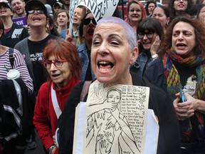 Meryl Ranzer joins other protesters gathering to demonstrate against Supreme Court Nominee Brett Kavanaugh near Washington Square Park on October 6, 2018 in New York City. (Yana Paskova/Getty Images)