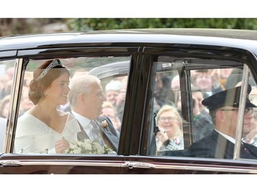 WINDSOR, ENGLAND - OCTOBER 12:  Princess Eugenie of York and her father Prince Andrew, Duke of York arrive for the wedding of Princess Eugenie of York to Jack Brooksbank at St. George's Chapel on October 12, 2018 in Windsor, England.