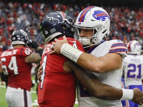 Deshaun Watson, left, of the Houston Texans greets Nathan Peterman of the Buffalo Bills after the game at NRG Stadium on Oct. 14, 2018 in Houston, Texas. (Tim Warner/Getty Images)
