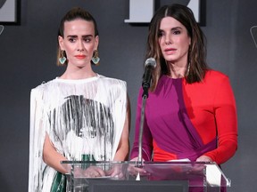 Sarah Paulson, left, and Sandra Bullock speak onstage during ELLE's 25th Annual Women In Hollywood Celebration at Four Seasons Hotel Los Angeles at Beverly Hills on October 15, 2018 in Los Angeles, Calif.  (Michael Kovac/Getty Images for ELLE Magazine)